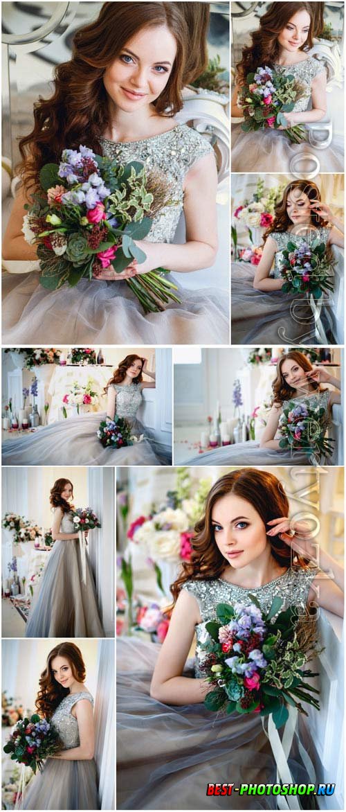 Girl in evening dress with a bouquet of flowers stock photo