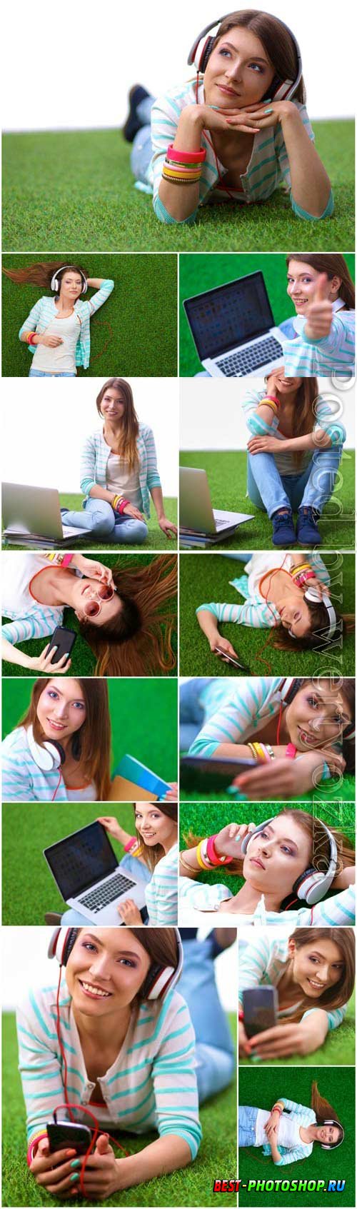 Girl with gadgets on green grass stock photo